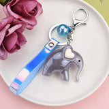 Sidiou Group Wholesale Acrylic Cute Cartoon Elephant Doll Magic Color Leather Rope Keychain Ladies Bag Pendant